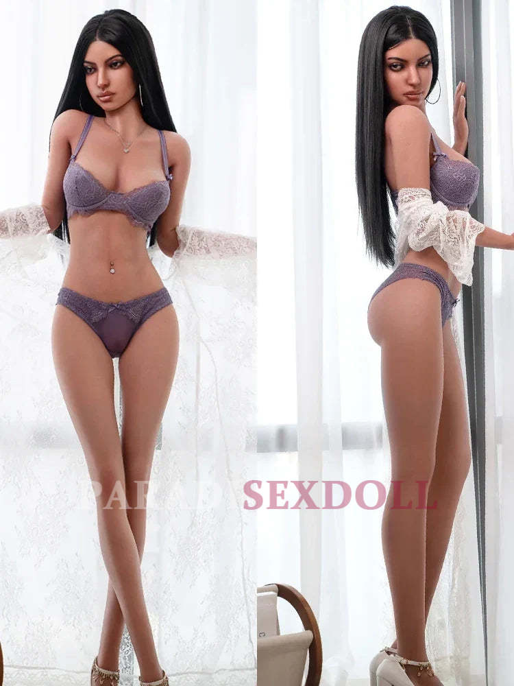 Lifelike silicone sex doll with long black hair, dressed in a stylish purple lace lingerie set, posed elegantly against a light background, showcasing her realistic features, intricate craftsmanship, and seductive figure.