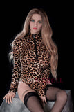 158cm K-Cup sex doll dressed in a leopard print bodysuit, featuring long blonde hair and striking green eyes. The doll is seated elegantly on a pedestal with a soft pose, showcasing defined curves, detailed facial features, and knee-high stockings against a black background.