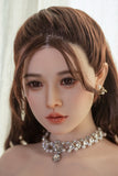 Detailed image of the Asian silicone sex doll Qiuyue, showcasing realistic facial features, long brown hair styled elegantly, and a sparkling necklace. The doll's expression highlights lifelike qualities, perfect for collectors and enthusiasts.