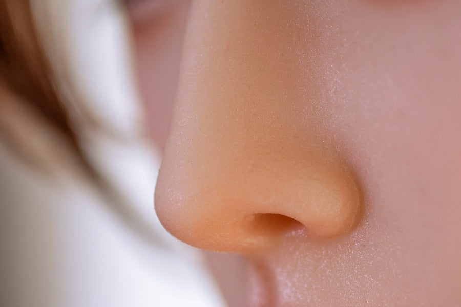 Close-up of the lifelike nose of Asian silicone sex doll Qiuyue, 170cm tall, emphasizing realistic skin texture and intricate details, ideal for demonstrating high-quality craftsmanship in adult dolls.